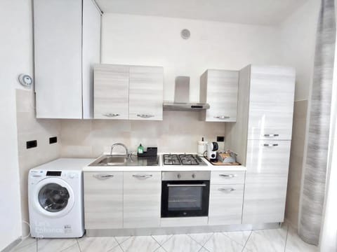 Kitchen or kitchenette, oven, stove, toaster, washing machine, kitchen