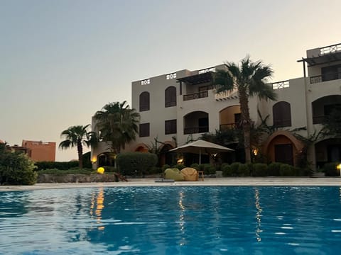 Property building, Pool view, Swimming pool, sunbed
