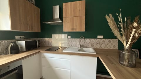 Kitchen or kitchenette, dishwasher, microwave, stove, toaster