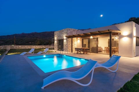 Property building, Patio, Night, Natural landscape, Mountain view, Pool view, Swimming pool, sunbed