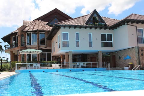 Property building, Day, Pool view, Swimming pool, sunbed