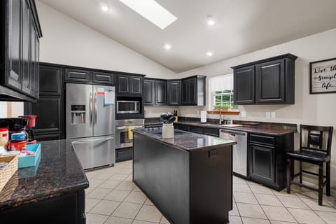 Kitchen or kitchenette, dishwasher, oven, stove