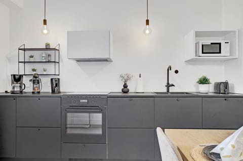 Kitchen or kitchenette, dishwasher, oven, stove, toaster