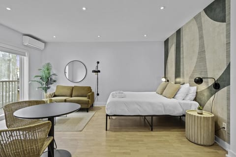 Bed, Living room, Seating area, Bedroom