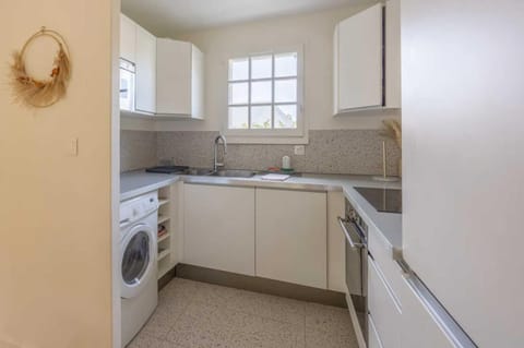 Kitchen or kitchenette, microwave, oven, stove, washing machine