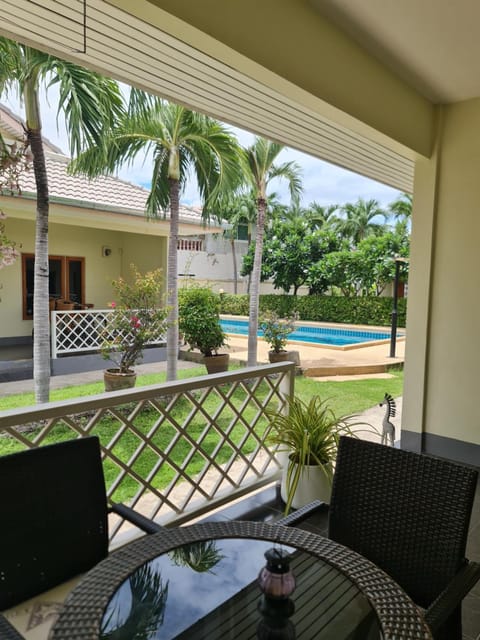 Property building, Patio, Garden, Balcony/Terrace, Seating area, Dining area, Garden view, Pool view, Swimming pool
