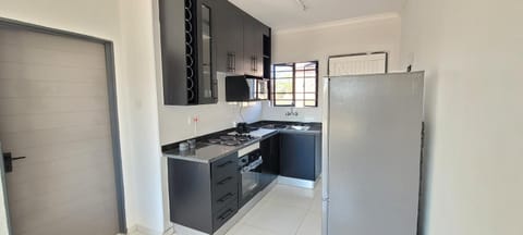 Kitchen or kitchenette, microwave, oven, stove
