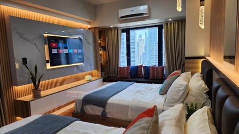 Communal lounge/ TV room, Bed, TV and multimedia, Living room, Photo of the whole room, Seating area, Evening entertainment, Bedroom, air conditioner
