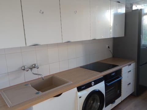 Kitchen or kitchenette, stove, washing machine