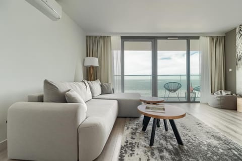 Living room, Seating area, Sea view, air conditioner