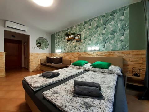 Bed, Living room, Photo of the whole room, Bedroom, towels, air conditioner