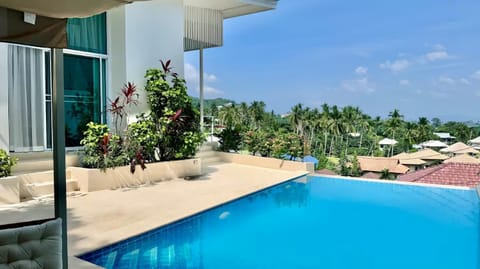 Property building, Patio, Day, Garden, View (from property/room), Balcony/Terrace, Garden view, Pool view, Swimming pool, sunbed