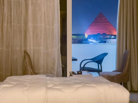 Bed, Natural landscape, Living room, Photo of the whole room, Seating area, Bedroom, Landmark view