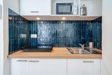 Kitchen or kitchenette, stove