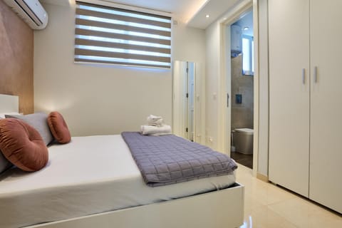 Bed, Bedroom, towels, wardrobe, air conditioner