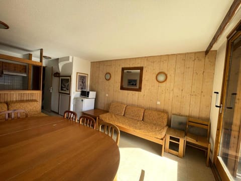 Bed, fireplace, kitchen