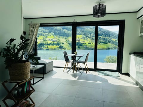 Patio, Natural landscape, View (from property/room), Balcony/Terrace, Living room, Seating area, Dining area, Lake view, Mountain view, River view