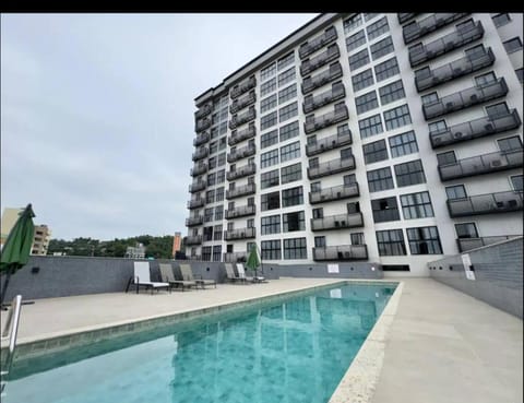 Property building, Pool view, Swimming pool, sunbed
