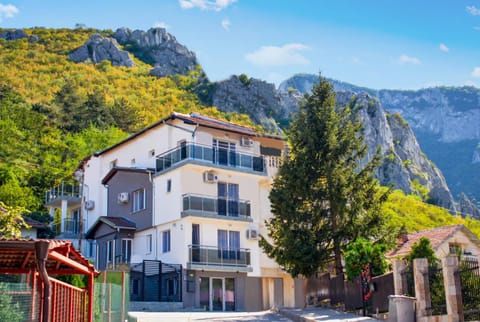 Property building, Nearby landmark, Natural landscape, Mountain view