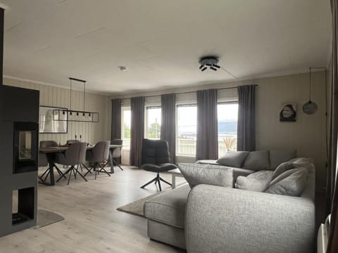 View (from property/room), Living room, Seating area, Dining area, fireplace