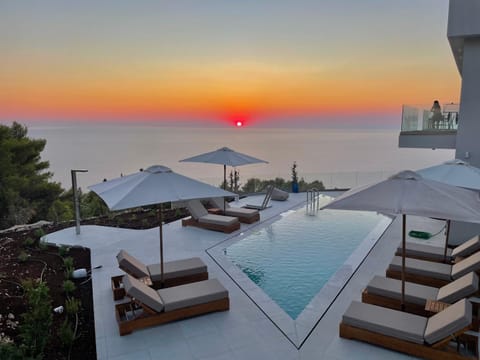 Patio, Natural landscape, Pool view, Sea view, Swimming pool, Sunset, sunbed