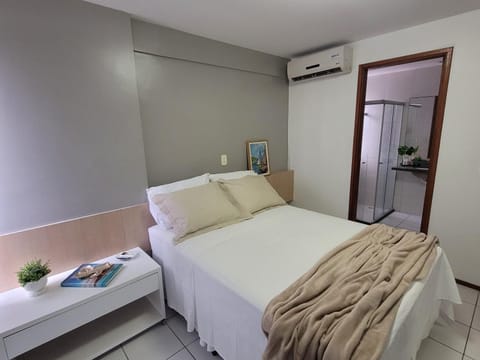 Bed, towels, wardrobe, air conditioner