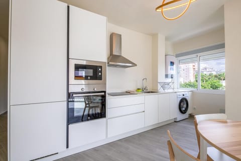 Kitchen or kitchenette, Dining area, oven, stove, toaster, washing machine, dryer