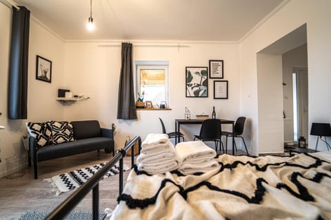 Bed, Living room, Seating area, Bedroom
