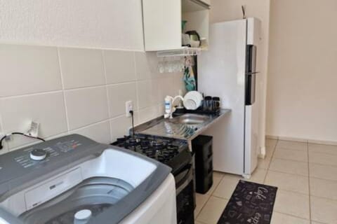 Kitchen or kitchenette, minibar, stove, washing machine
