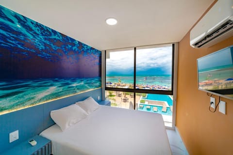 Bed, Natural landscape, TV and multimedia, View (from property/room), Photo of the whole room, Bedroom, Pool view, Sea view