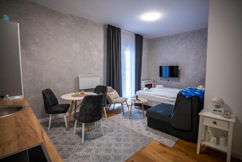 Bed, TV and multimedia, Living room, Seating area, Dining area, Bedroom