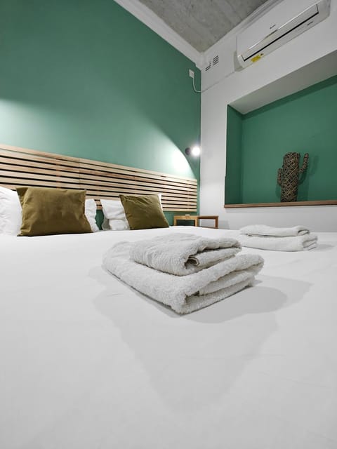 Bed, Photo of the whole room, Bedroom, towels, air conditioner