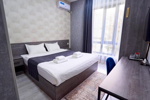 Bed, Photo of the whole room, Bedroom, towels, air conditioner