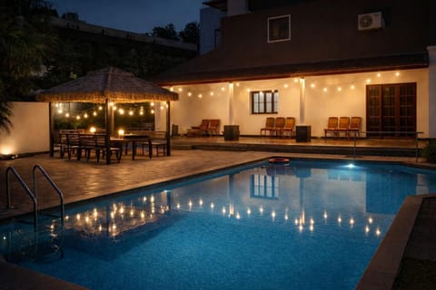 Property building, Patio, Night, Pool view, Swimming pool