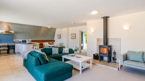 Living room, Seating area, Dining area, fireplace, oven, stove, kitchen