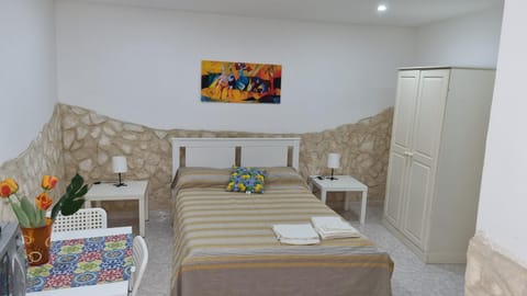 Bed, towels, wardrobe