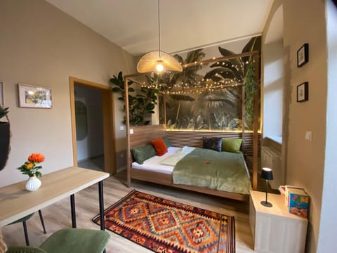 Bed, Living room, Seating area, Bedroom