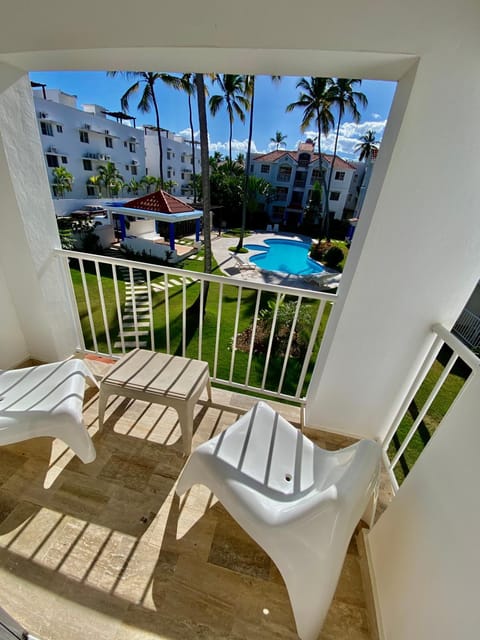 Property building, Patio, Day, View (from property/room), Balcony/Terrace, Seating area, Dining area, Pool view, Swimming pool, Parking, sunbed