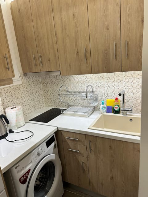 Kitchen or kitchenette, stove, washing machine