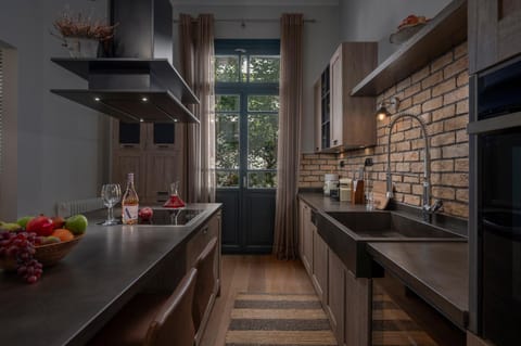 Kitchen or kitchenette, dishwasher, oven, stove