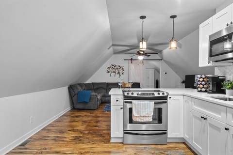 Kitchen or kitchenette, Living room, Seating area, furniture, oven, stove