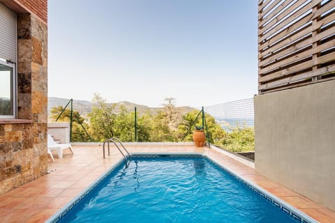 Property building, Living room, Swimming pool