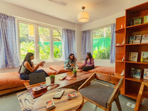 People, Library, Living room, Seating area, group of guests