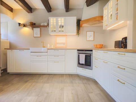 Kitchen or kitchenette, dishwasher, oven, stove, toaster