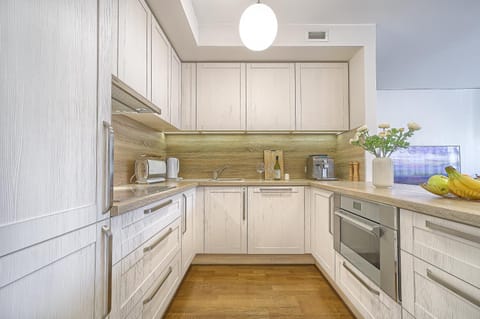 Kitchen or kitchenette, dishwasher, oven, stove