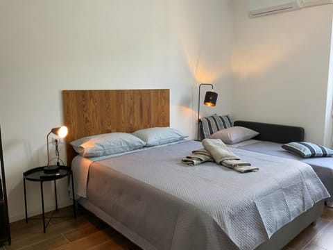 Bed, Photo of the whole room, Bedroom, towels, air conditioner