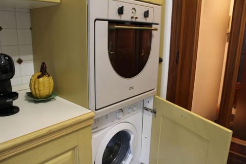 Kitchen or kitchenette, washing machine