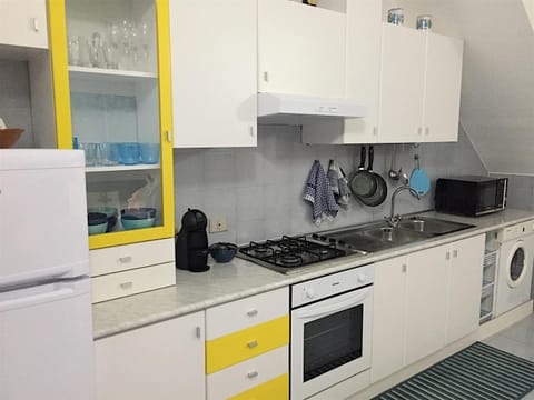 Kitchen or kitchenette, microwave, oven, stove, washing machine, kitchen