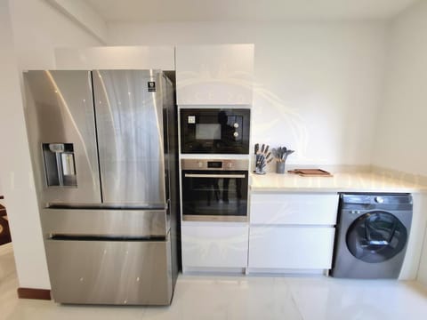 Kitchen or kitchenette, microwave, oven, washing machine, kitchen