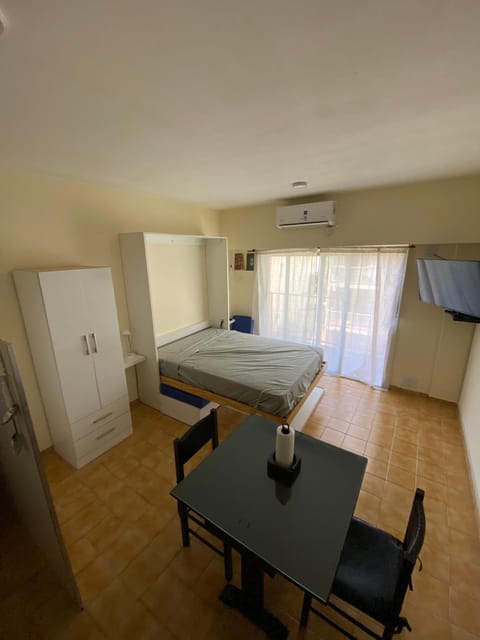 Bed, TV and multimedia, Balcony/Terrace, Dining area, furniture, air conditioner